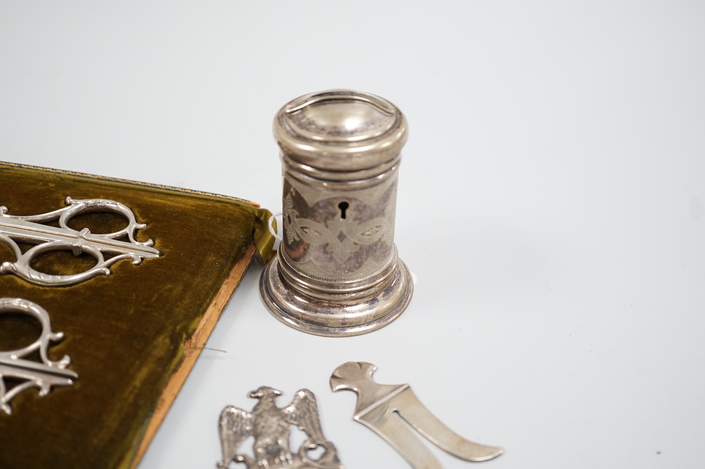 Judaica - a cased pair of scissors, a Tzedakah box, a Victorian silver circumcision guard, London 1888 and a similar plated example